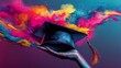 © rashyn - Hand holds a graduation cap against a burst of colorful, abstract paint. Vibrant art