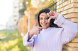 © luismolinero - Young woman at outdoors focusing face. Framing symbol