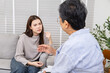 © Rakchanok - Psychologist, consultation, mental health, therapy, counseling, woman client describing problem to senior professional counselor, conflict workplace anxiety, career struggle, trust and emotional care.