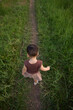 © Tuan - toddler exploring grass path