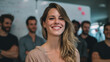 © buraratn - Confident woman smiles warmly in professional setting, surrounded by group of colleagues. atmosphere is collaborative and positive, reflecting teamwork and camaraderie
