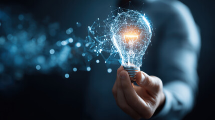 Wall Mural - innovative concept of glowing light bulb held by hand, symbolizing creativity and ideas. bulb is sur