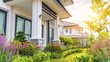 © Lol - Sunlit modern home with a lush garden and elegant columns