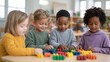 © SerPak - Four children engaged in play with colorful building blocks in a bright classroom, fostering creativity and teamwork.