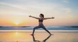 © waqas - Woman practicing warrior two yoga pose on the beach at sunset with ocean and sky in background