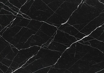 Closeup of black onyx stone with white cracked veins, featuring a luxurious and natural textured pattern