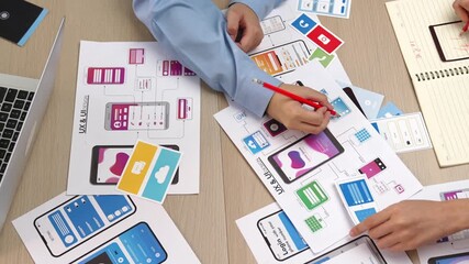 Wall Mural - top view panorama video of startup company employee planning on user interface prototype for mobile 