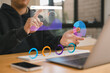 © Smallroombigdream - Businessman using futuristic augmented reality interface with data analytics dashboard, charts, and graphs for digital marketing, finance business strategy planning.