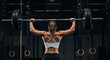 © Avery Quinn - Athletic woman performing weightlifting exercise in gym, showing muscular back strength and determination during overhead barbell lift.