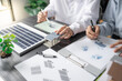 © Charlie's - Solar panels green energy Business man working green eco friendly office business creative idea Planing Bio economy for business eco friendly professional Engineer sustainable electricity.