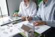 © Charlie's - Solar panels green energy Business man working green eco friendly office business creative idea Planing Bio economy for business eco friendly professional Engineer sustainable electricity.