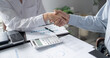 © Charlie's - Businessman shaking hands successful making a deal. mans handshake. Business partnership meeting concept