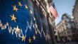 © Kdhtdg - The European flag with yellow stars is blurred against the background of stock market charts,