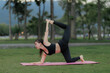 © Wanchai - Serene yoga practice in the evening, Asian woman in work attire turned activewear, embracing peace and health.