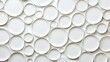 © Kropotkin - A collection of white plates arranged in a circular pattern.