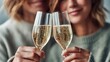 © NovaVision - Two people clink champagne glasses, celebrating a toast of joy and happiness together.
