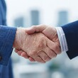 © world - Handshake Agreement: An elegant handshake between two professionals against the backdrop of a modern cityscape, symbolizing agreement, partnership.