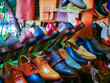 Handmade leather goods on display in old town Hoi An, Danang, featuring men dress shoes, boots, sandals, and bags. A vibrant showcase of Vietnamese craftsmanship at a street-side artisan shop