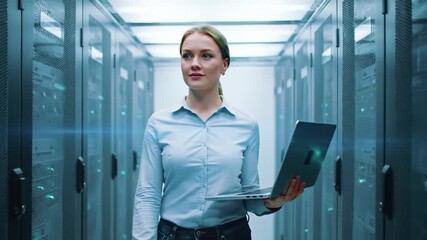 Woman walking in server room holding laptop data center technology network digital