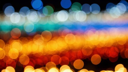 A vibrant bokeh effect with a gradient of warm oranges and reds transitioning to cool blues and whites, creating an abstract and festive background