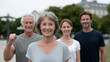 © Denis Yevtekhov - A senior group cheering after a workout in a park, senior fitness, group exercise, outdoor workout, healthy aging, joyful moment