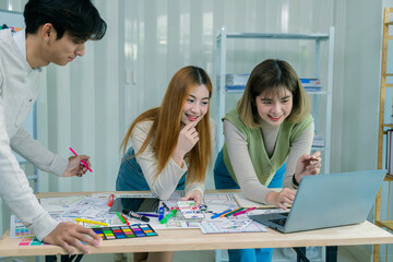 a team of developers collaborates to plan uxui designs, working on wireframes for website and mobile