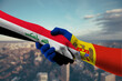 ©  UniqueEye - Shaking hands Iraq and Moldova