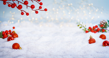 Wall Mural - christmas holiday background with snow, fir tree and decorations with christmas light behind. christ
