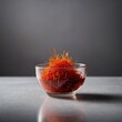 © Yevhen - Studio macro photo of saffron threads in a glass bowl, vivid colors ideal for premium culinary and gourmet food concepts.