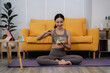© Kritdanai - Woman Eating Salad After Yoga at Home
