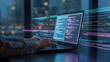 © Bykea - Professional coder typing fast at his laptop in the modern office at nighttime