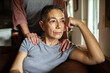 © Marko Geber - Stressed woman receiving comforting support from her lesbian partner at home