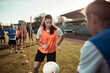 © Davor - Teen girl practicing soccer drills during team training at stadium