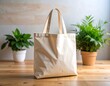 © Dagelan - Beige canvas tote bag on a wooden table with plants