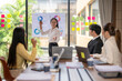 © Apichat - Asian businesswoman leading meeting, presenting charts and statistics to her colleagues