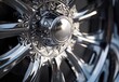 © Enjoy - Close Up of a Highly Polished Chrome Wheel with Intricate Details