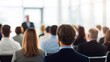 © N7 - Business audience listening in bright conference room — back view highlighting seminar atmosphere