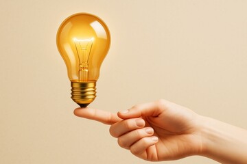 Wall Mural - hand balancing glowing light bulb with fingertip on beige background symbolizing innovation and crea