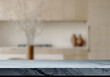 © pedro - Empty marble top table with blurred kitchen interior Background. for product display.