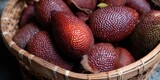 A close-up view of salak fruits in a woven basket, ready to enjoy their unique taste.