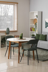 Poster - stylish living room with soft sofa, table and shelving unit