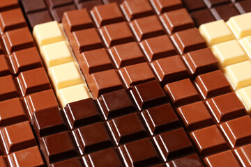 Wall Mural - Different sweet chocolate bars as background, closeup