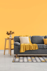 Poster - interior of living room with autumn decor and sofa