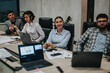 © qunica.com - Group of business colleagues brainstorm ideas and strategies for growth during a late night meeting at a modern office. Different generations and cultures contribute to creative project solutions.