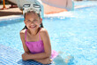 © New Africa - Little girl wearing diving mask in swimming pool. Summer vacation
