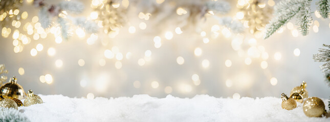 Wall Mural - christmas holiday background with snow, fir tree and decorations with christmas light behind