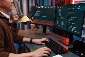 Serious of IT developers discussing intelligent website development coder system running data online two screens with laptop showing information network at neon light room at modern office. Infobahn.