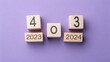 © Office - Wooden blocks displaying 2023 and 2024 transition, year change concept