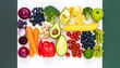 © Su - Colorful array of fresh fruits and vegetables arranged on a white surface