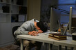 © Stella 16 - Tired Asian business man falling asleep at table Alone Working holding his head on hands after late night work. asian male employee